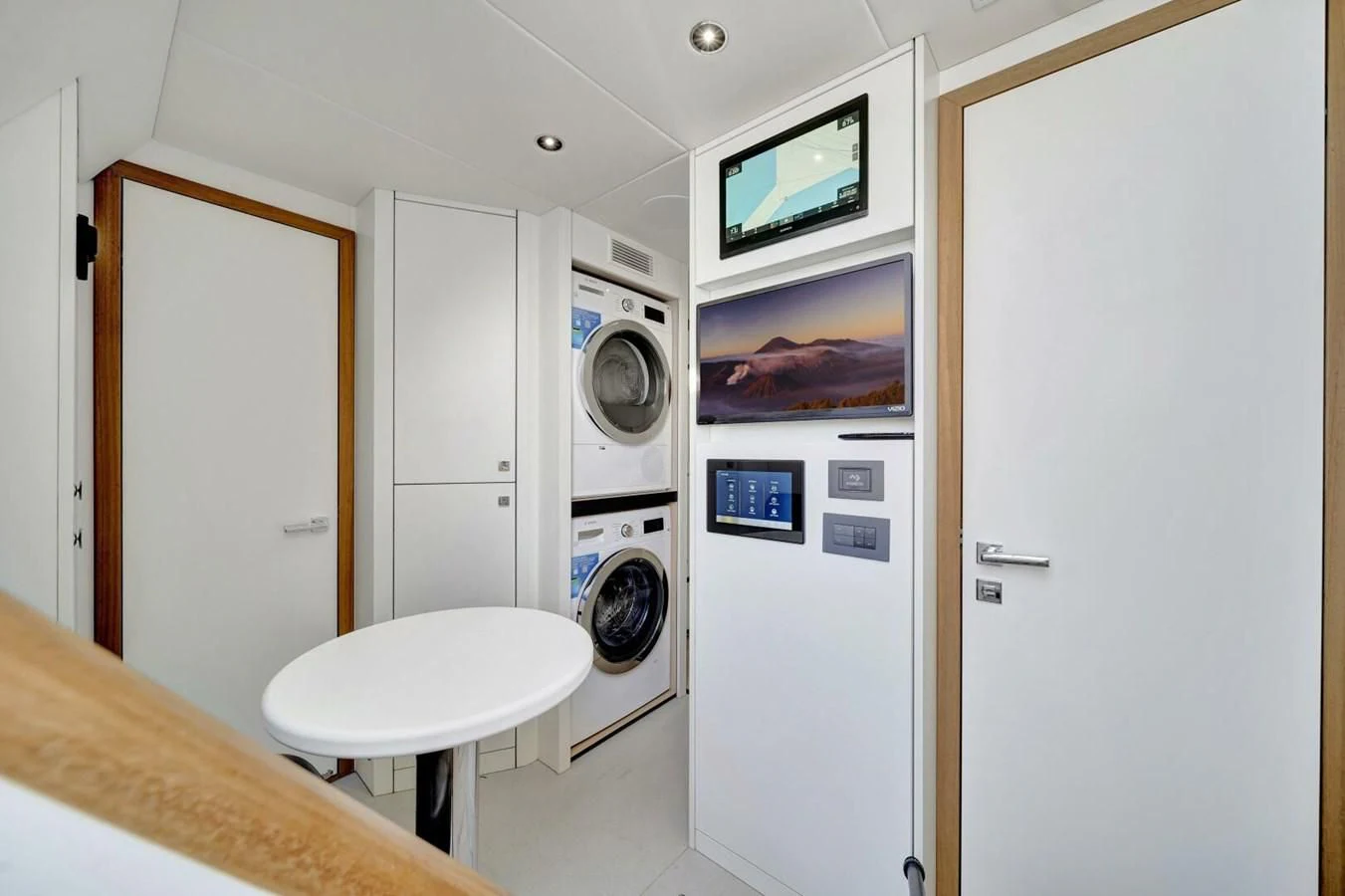 a room with a washing machine and a bed aboard 76 YACHT Yacht for Sale