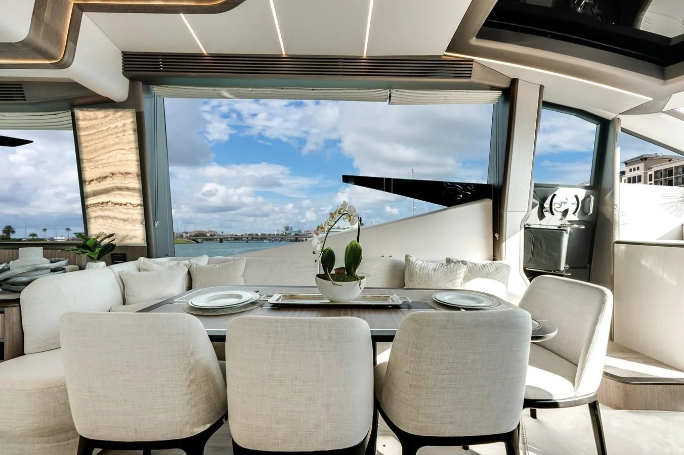 a large room with a table and chairs and a large window aboard 76 YACHT Yacht for Sale