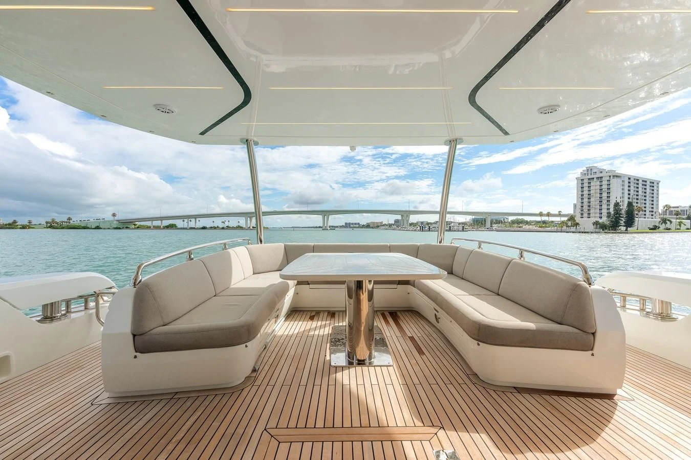 a room with a table and chairs on a deck aboard 76 YACHT Yacht for Sale