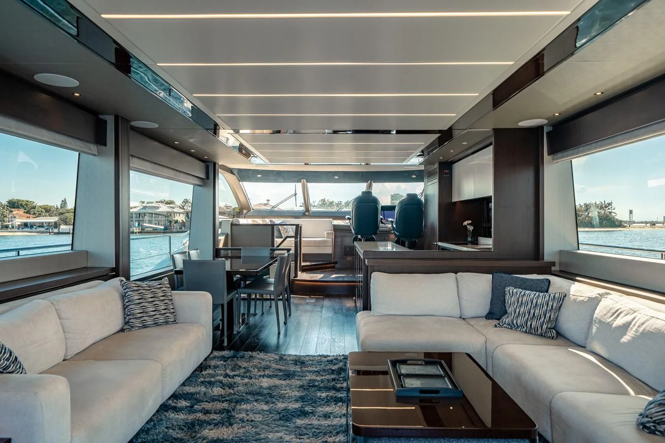 a train car with a couch and a table and chairs aboard 76 YACHT Yacht for Sale