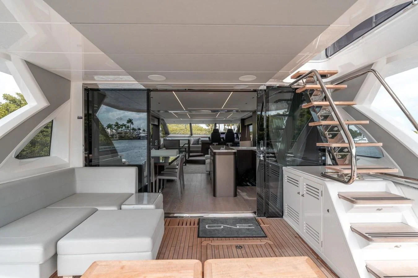 a room with a staircase and a glass door aboard 76 YACHT Yacht for Sale