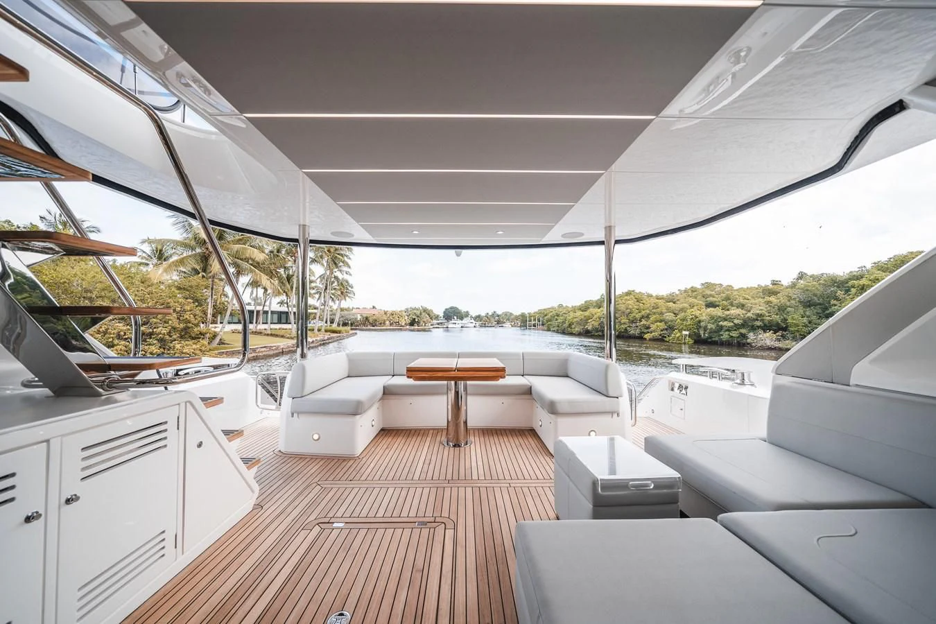 a room with a table and couches aboard 76 YACHT Yacht for Sale