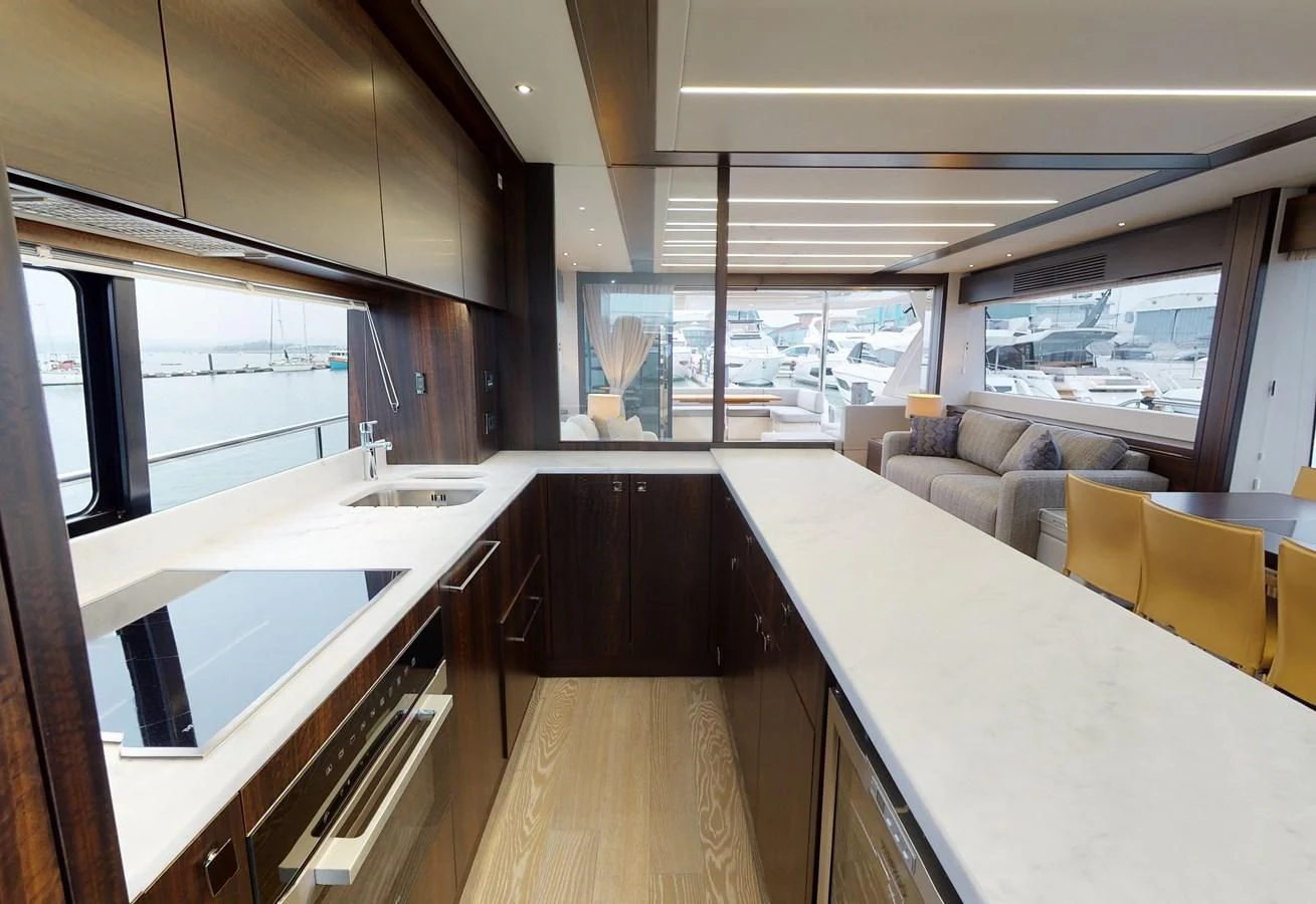 a large room with a large table and chairs aboard 76 YACHT Yacht for Sale