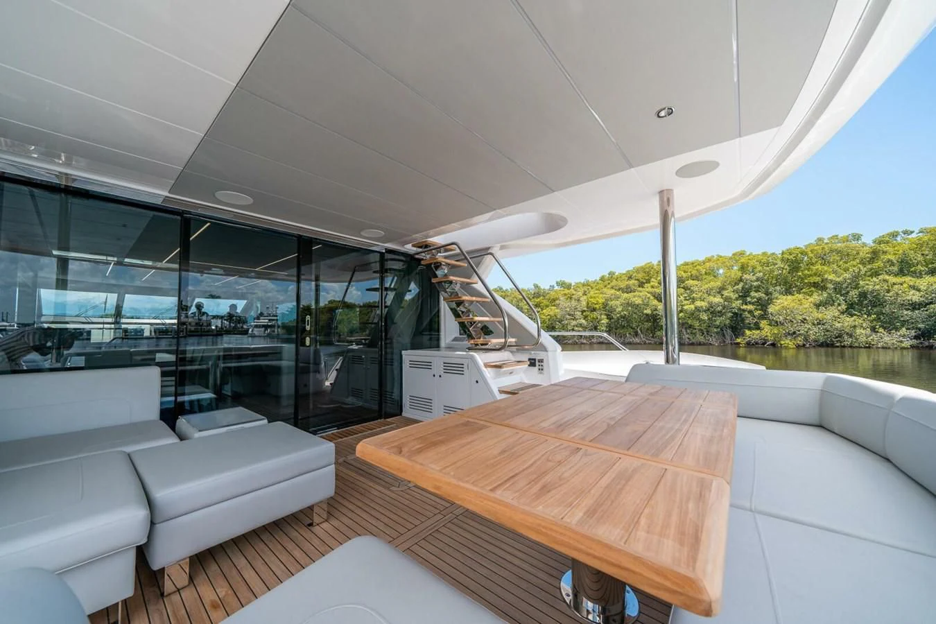 a room with a table and chairs aboard 76 YACHT Yacht for Sale