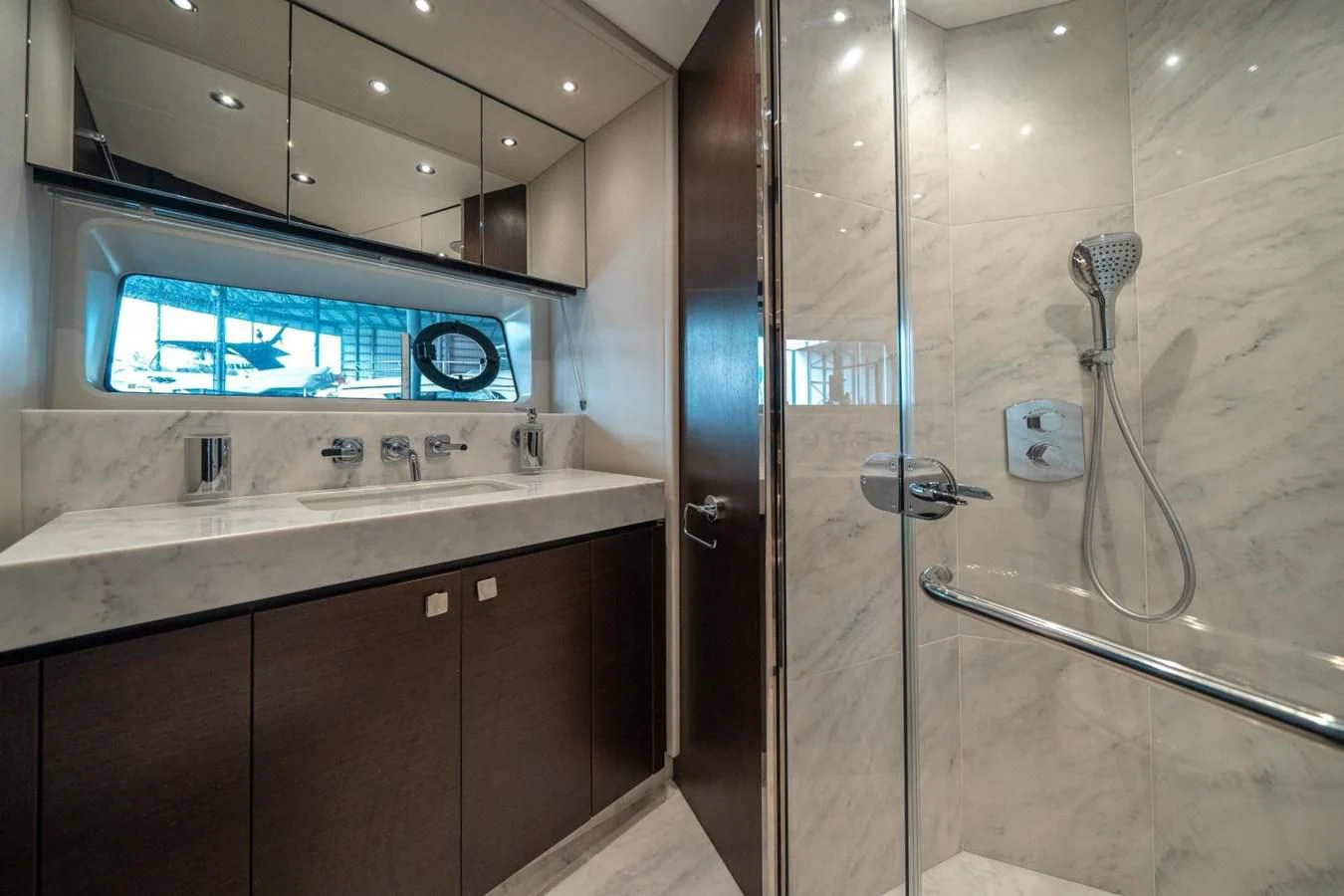 a bathroom with a glass shower aboard 76 YACHT Yacht for Sale