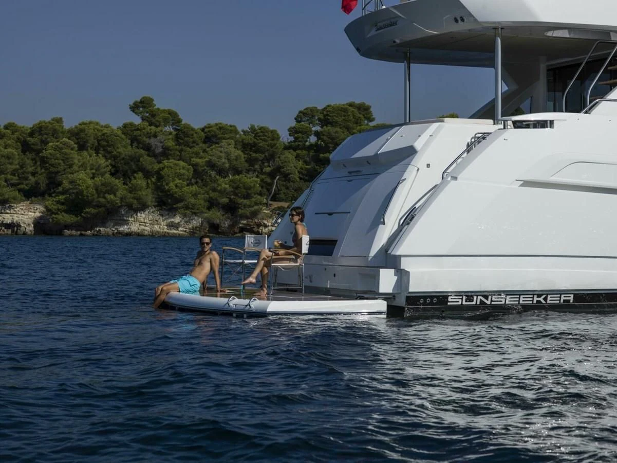 a group of people on a boat aboard 76 YACHT Yacht for Sale