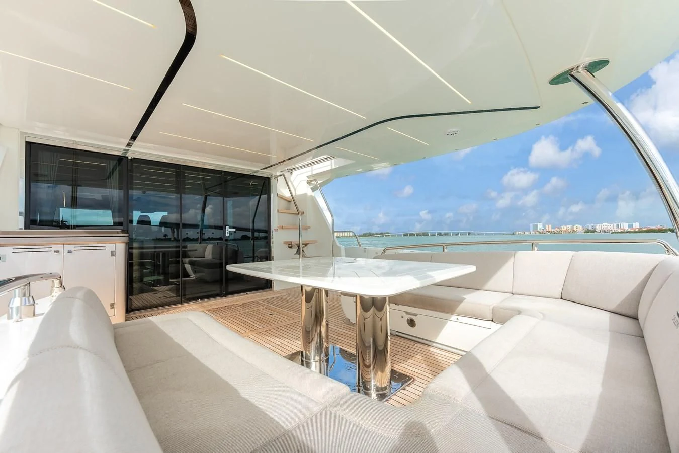 a room with a table and a couch aboard 76 YACHT Yacht for Sale