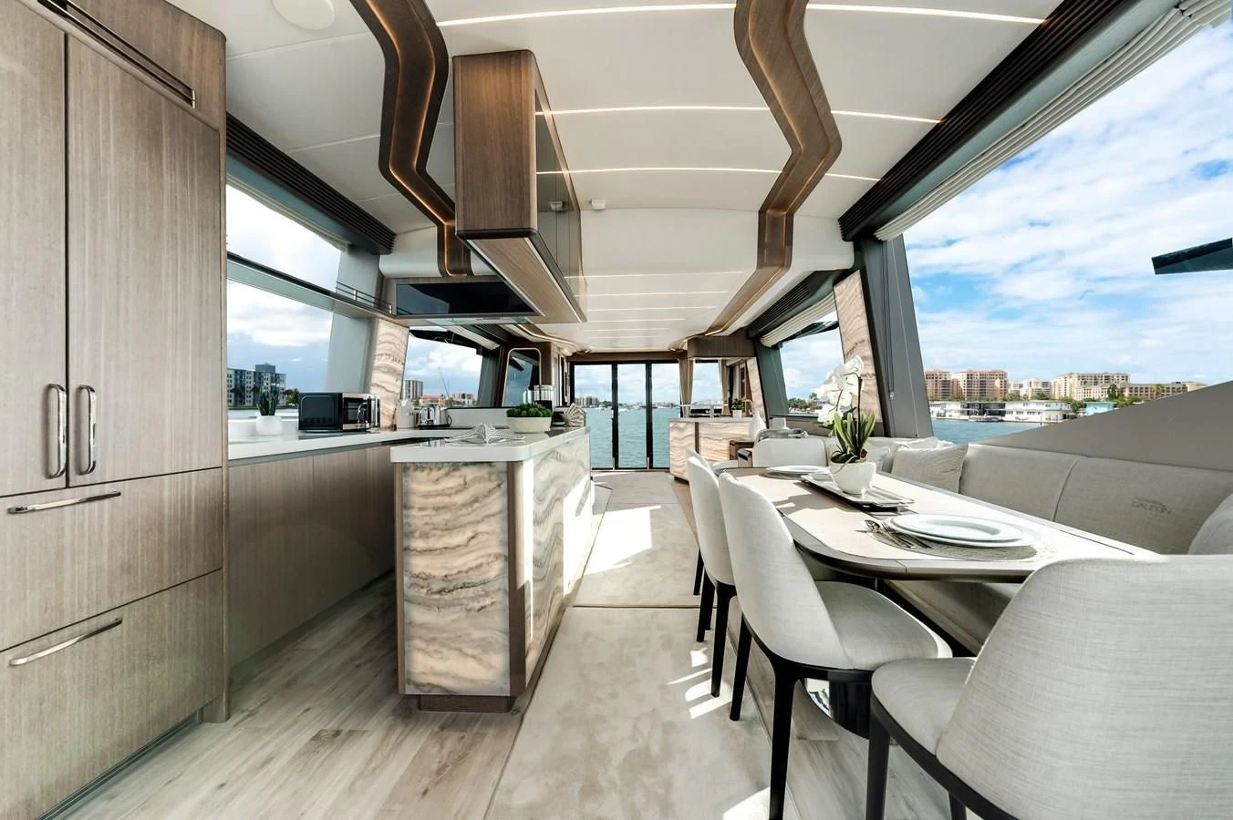 a kitchen with a table and chairs aboard 76 YACHT Yacht for Sale