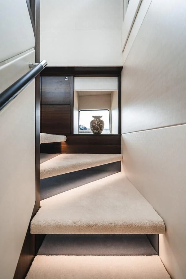 a cat sitting on a stair case aboard 76 YACHT Yacht for Sale