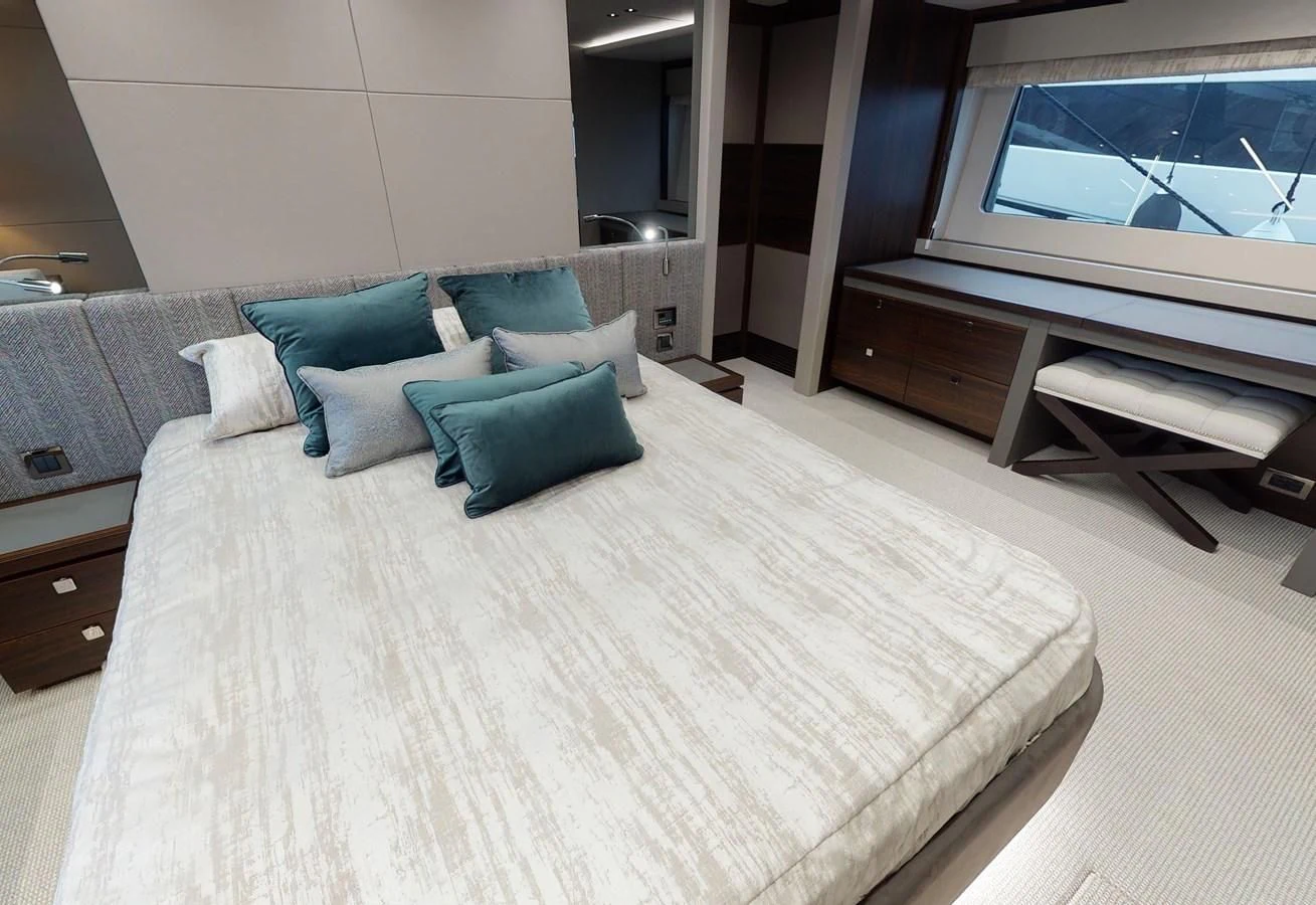 a bed with pillows and a television aboard 76 YACHT Yacht for Sale