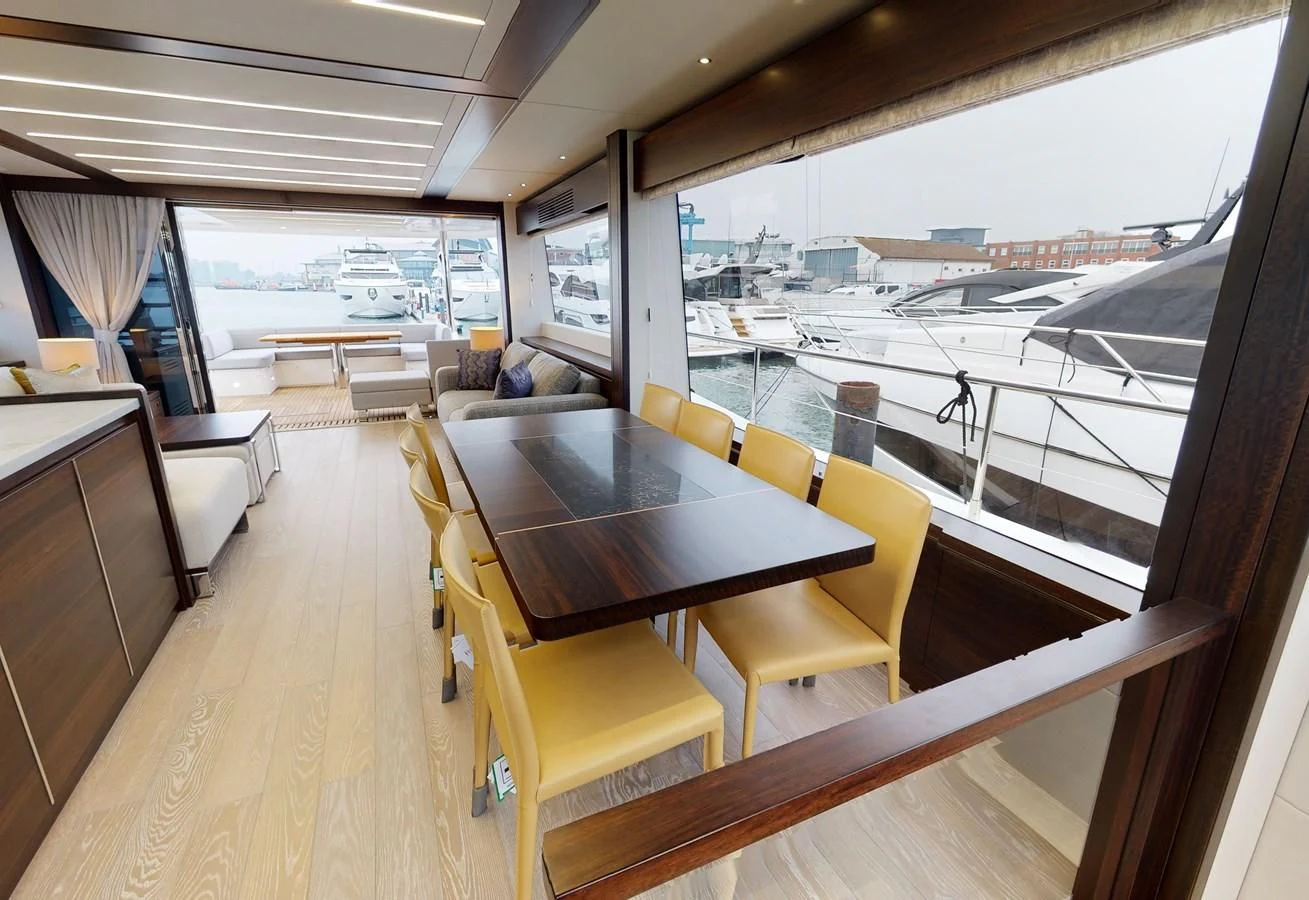 a room with a table and chairs aboard 76 YACHT Yacht for Sale