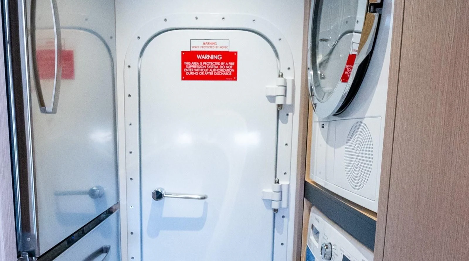 a white door with a red sign aboard 76 YACHT Yacht for Sale
