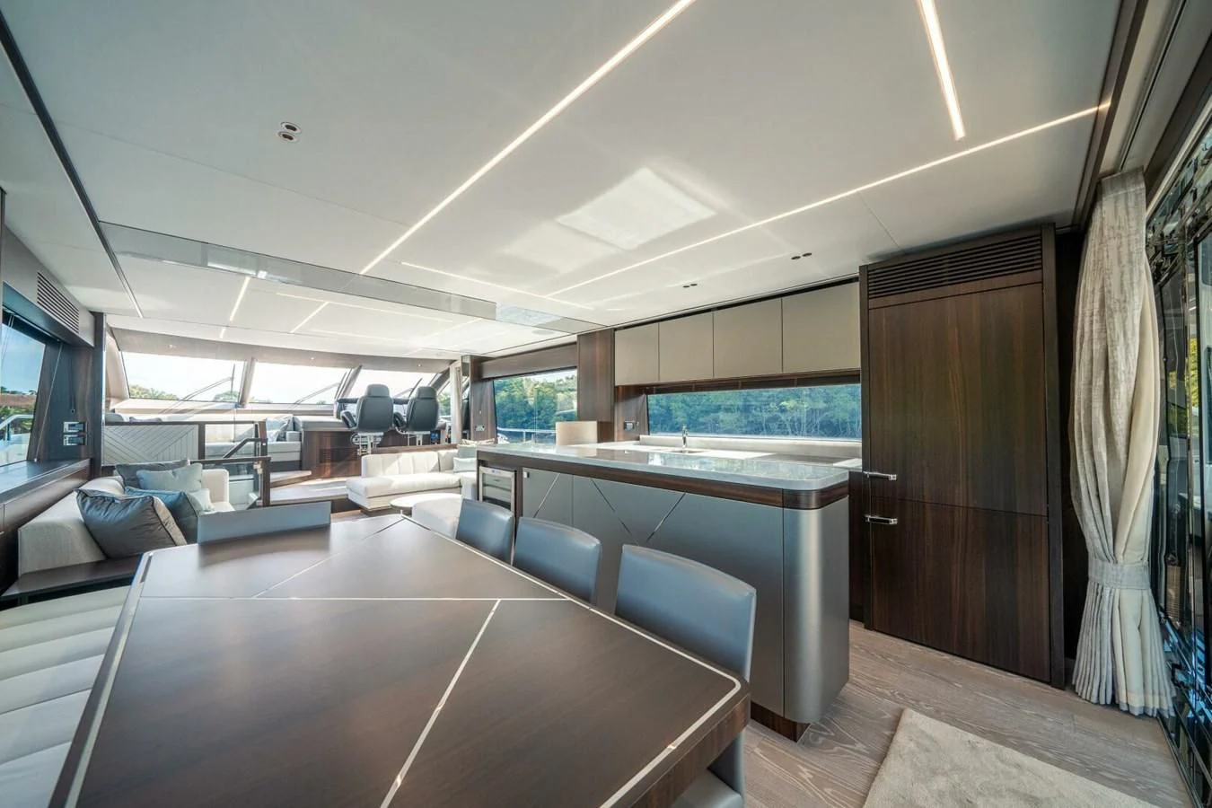 a room with a table and chairs aboard 76 YACHT Yacht for Sale