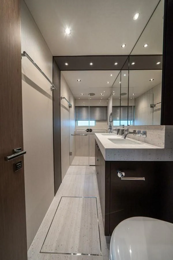 a bathroom with a sink and a mirror aboard 76 YACHT Yacht for Sale