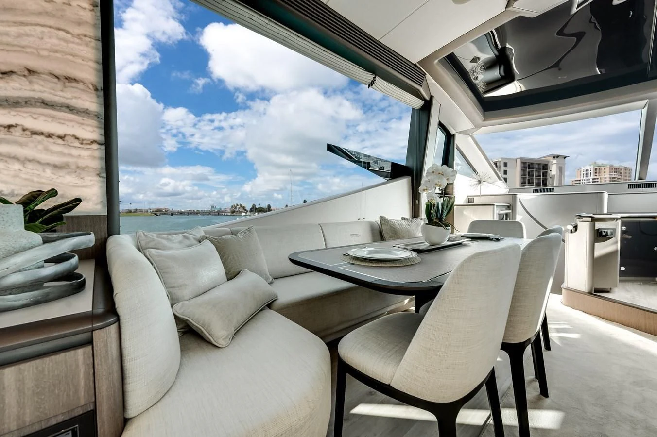a room with a table and chairs aboard 76 YACHT Yacht for Sale