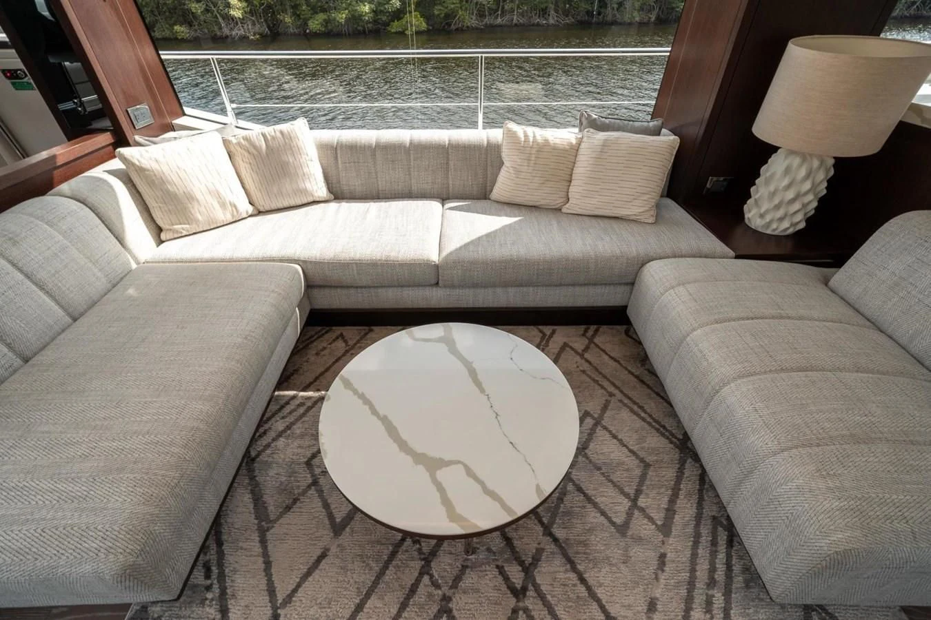 a couch and a table in a room aboard 76 YACHT Yacht for Sale