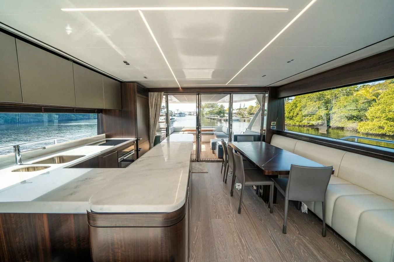 a room with a table chairs and a large window aboard 76 YACHT Yacht for Sale