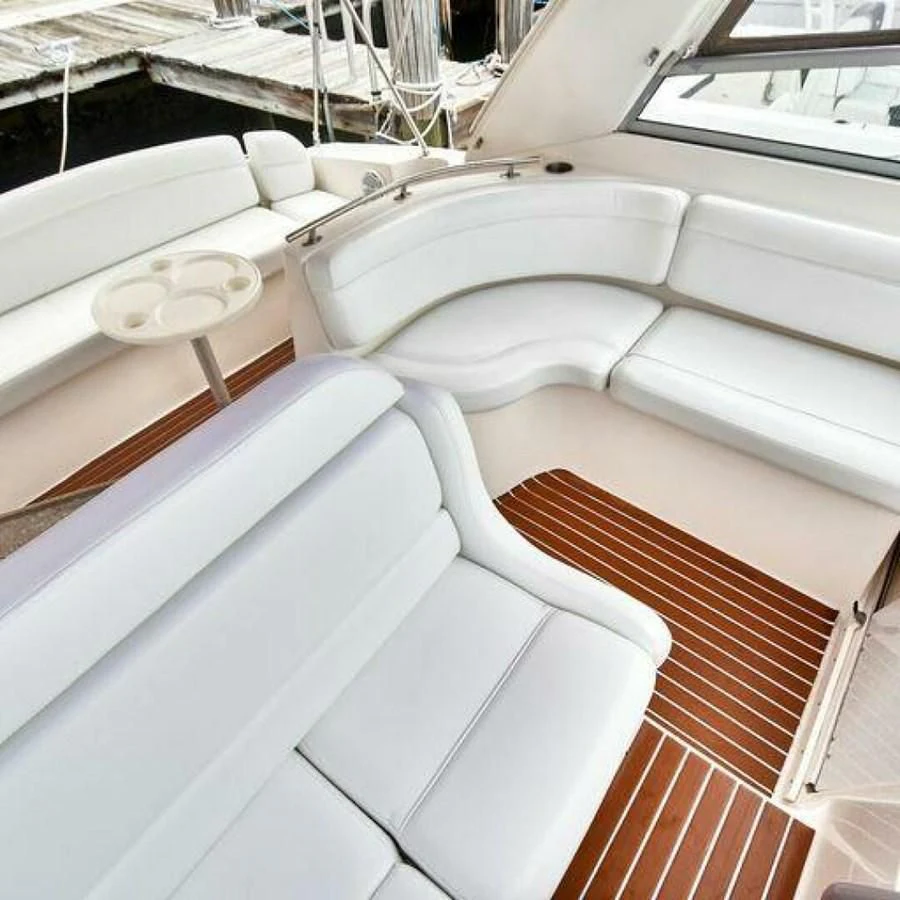 a group of white chairs outside aboard 76 YACHT Yacht for Sale