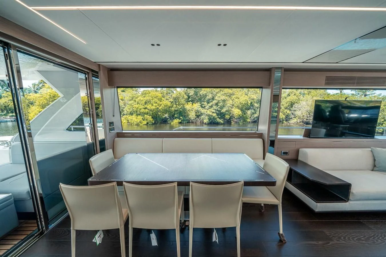 a room with a table and chairs aboard 76 YACHT Yacht for Sale