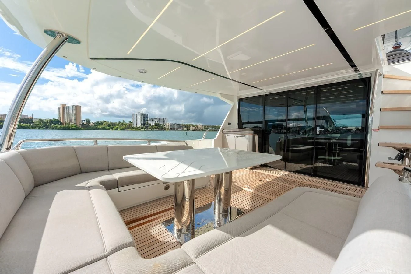 a room with a table and chairs aboard 76 YACHT Yacht for Sale