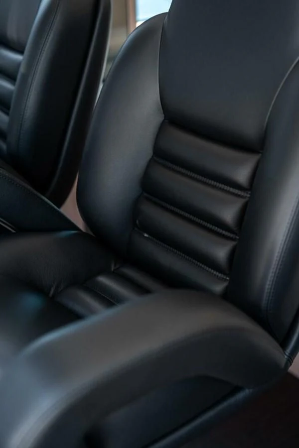 a black leather seat aboard 76 YACHT Yacht for Sale