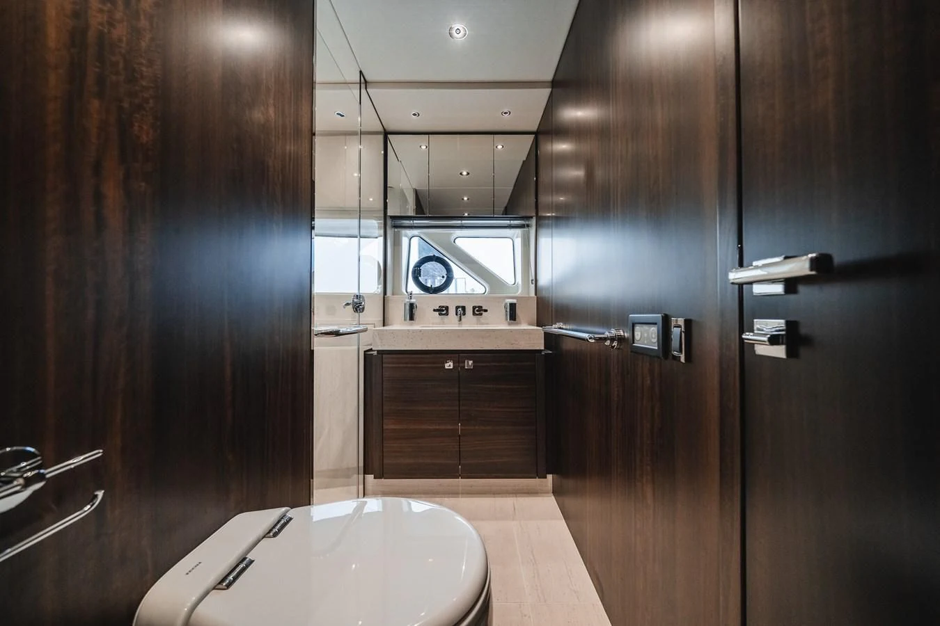 a kitchen with wooden cabinets aboard 76 YACHT Yacht for Sale