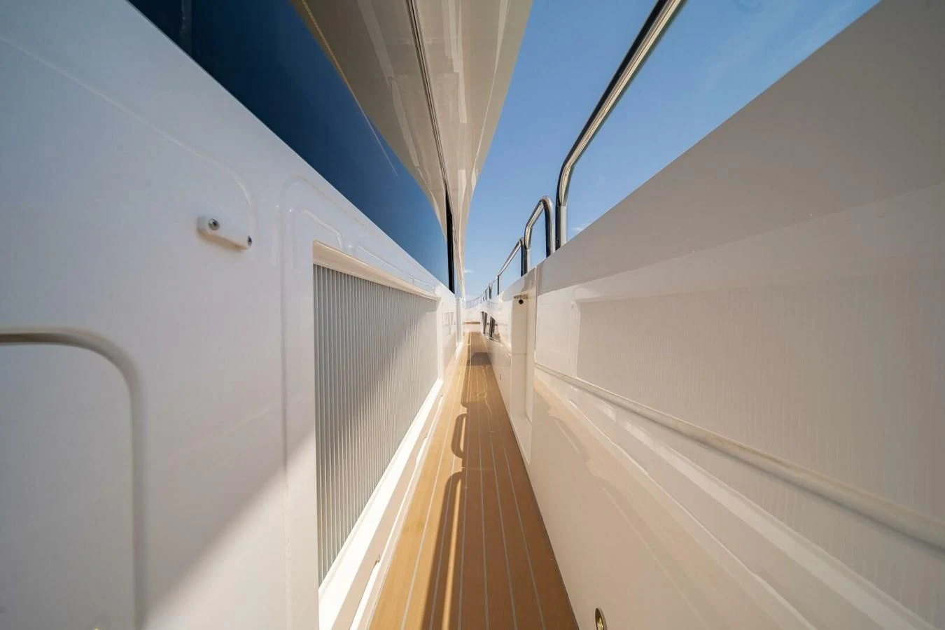 a long hallway with white walls aboard 76 YACHT Yacht for Sale