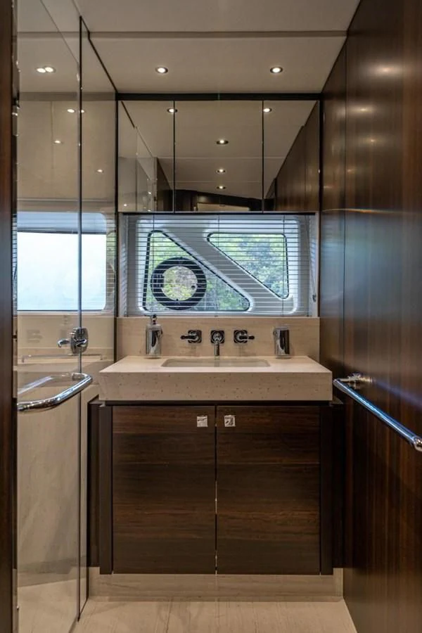 a bathroom with a sink and a shower unit aboard 76 YACHT Yacht for Sale