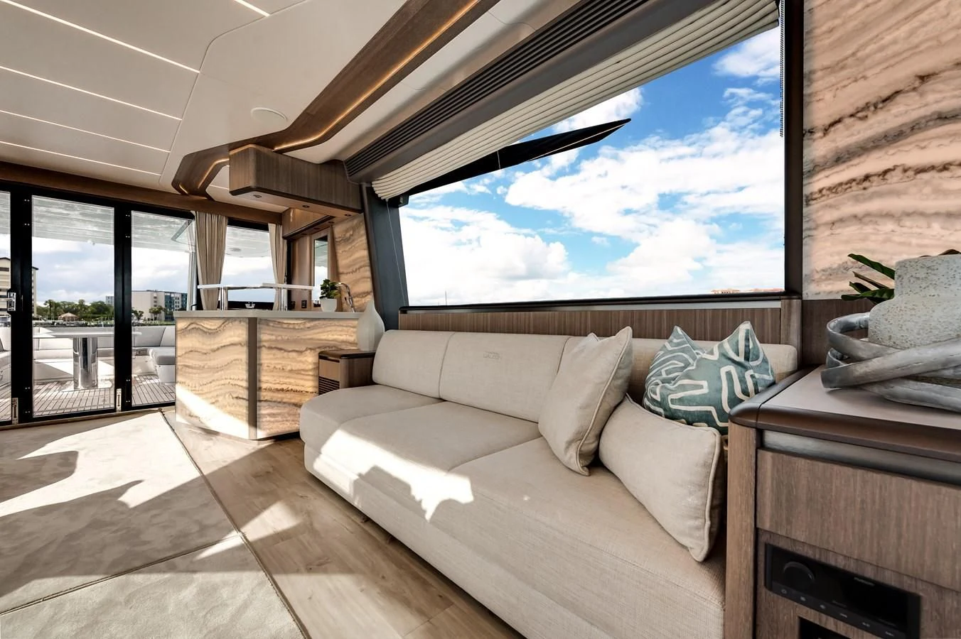 a room with a couch and a large window aboard 76 YACHT Yacht for Sale
