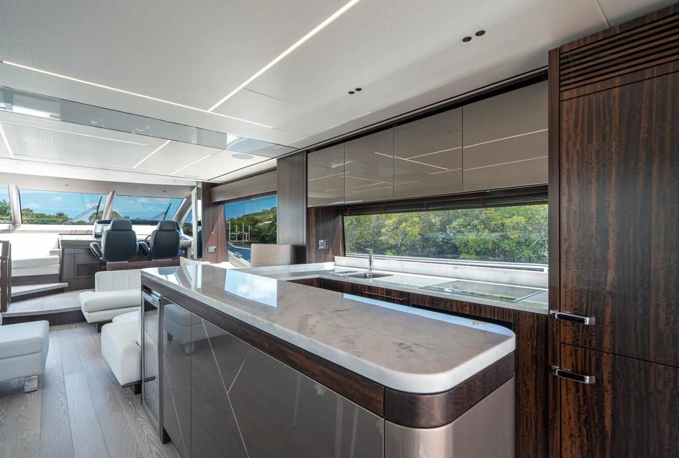 a room with a table and chairs aboard 76 YACHT Yacht for Sale