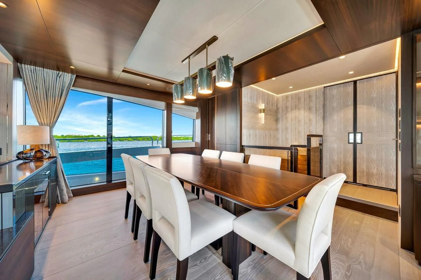 a large room with a table and chairs aboard 76 YACHT Yacht for Sale