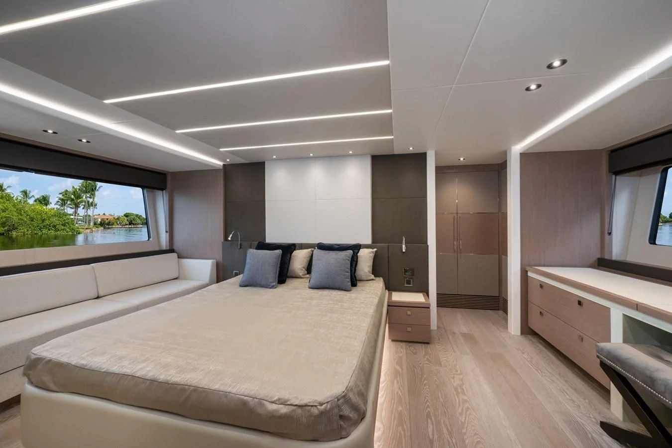 a bedroom with a bed and a desk aboard 76 YACHT Yacht for Sale