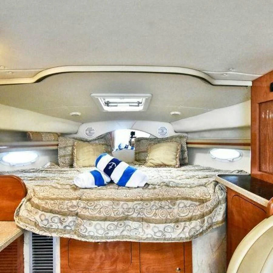 a bed with a pillow on it aboard 76 YACHT Yacht for Sale
