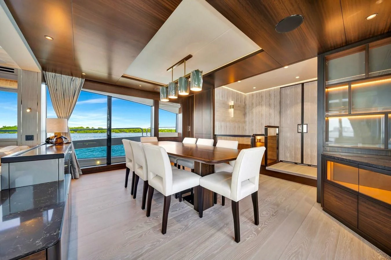 a room with a table chairs and a large window aboard 76 YACHT Yacht for Sale