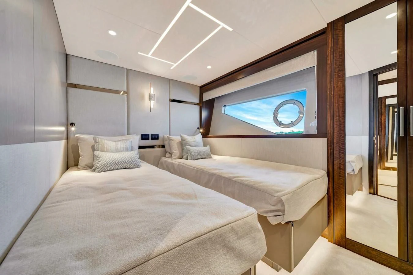 a room with a bed and a television on the wall aboard 76 YACHT Yacht for Sale
