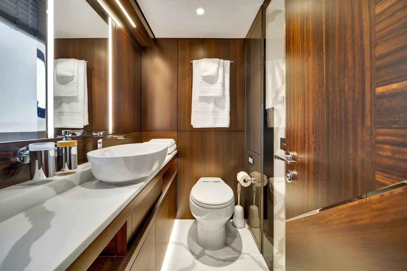 a bathroom with a sink toilet and a bathtub aboard 76 YACHT Yacht for Sale