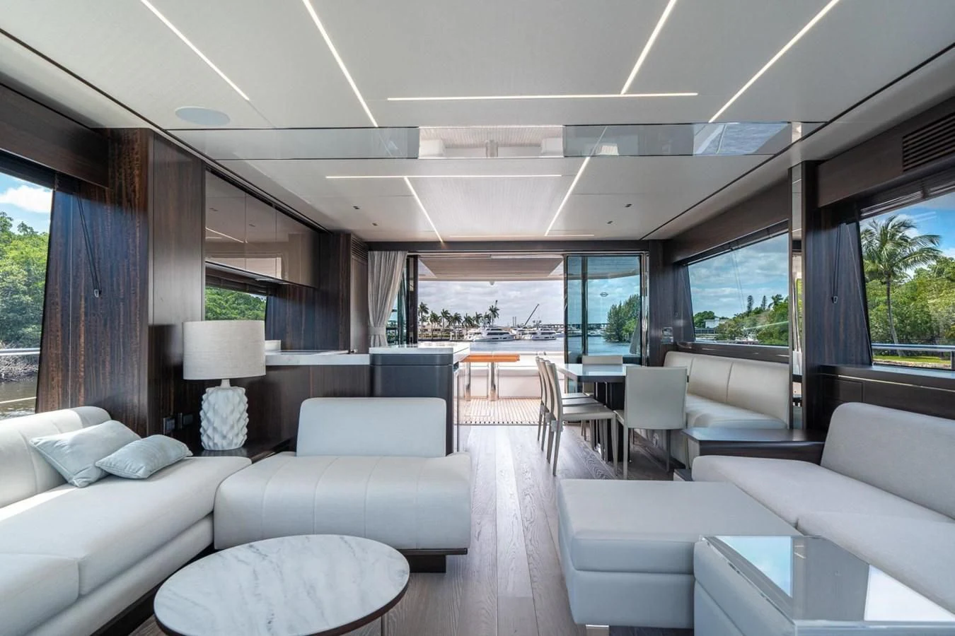 a large living room with a view of the water aboard 76 YACHT Yacht for Sale