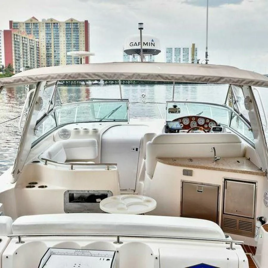 a boat with a table and chairs aboard 76 YACHT Yacht for Sale