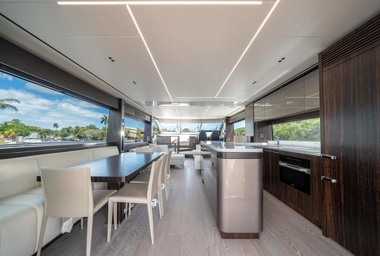 a room with a table chairs and a large window aboard 76 YACHT Yacht for Sale
