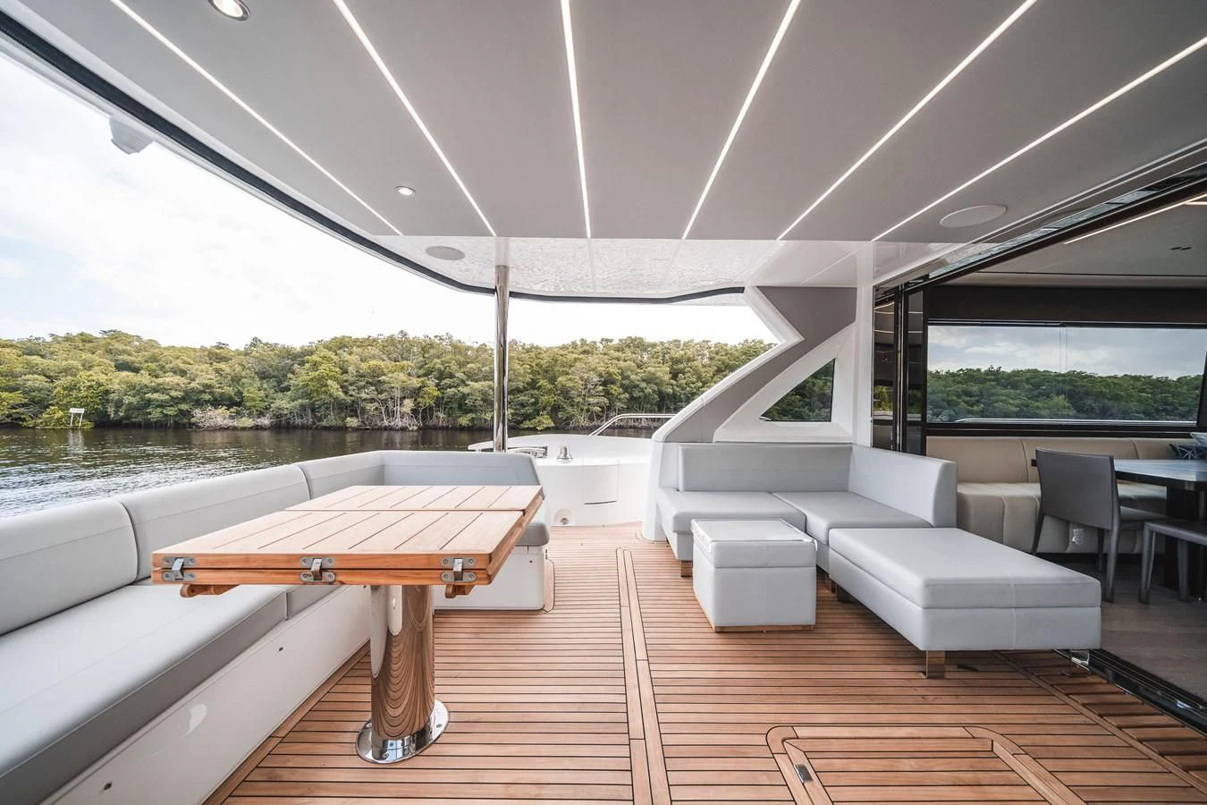 a room with a table and chairs aboard 76 YACHT Yacht for Sale