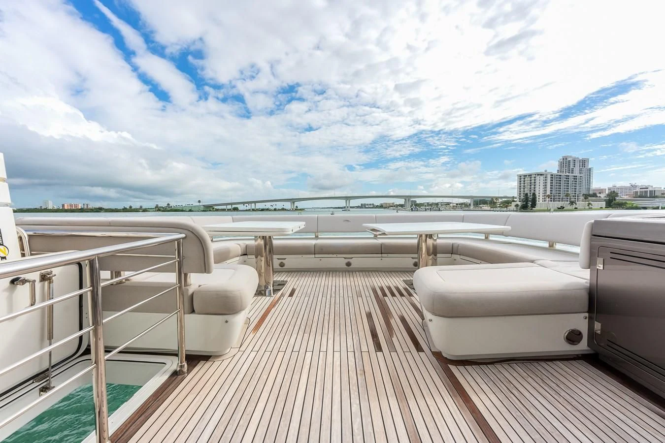 a deck with a view of a city and water aboard 76 YACHT Yacht for Sale