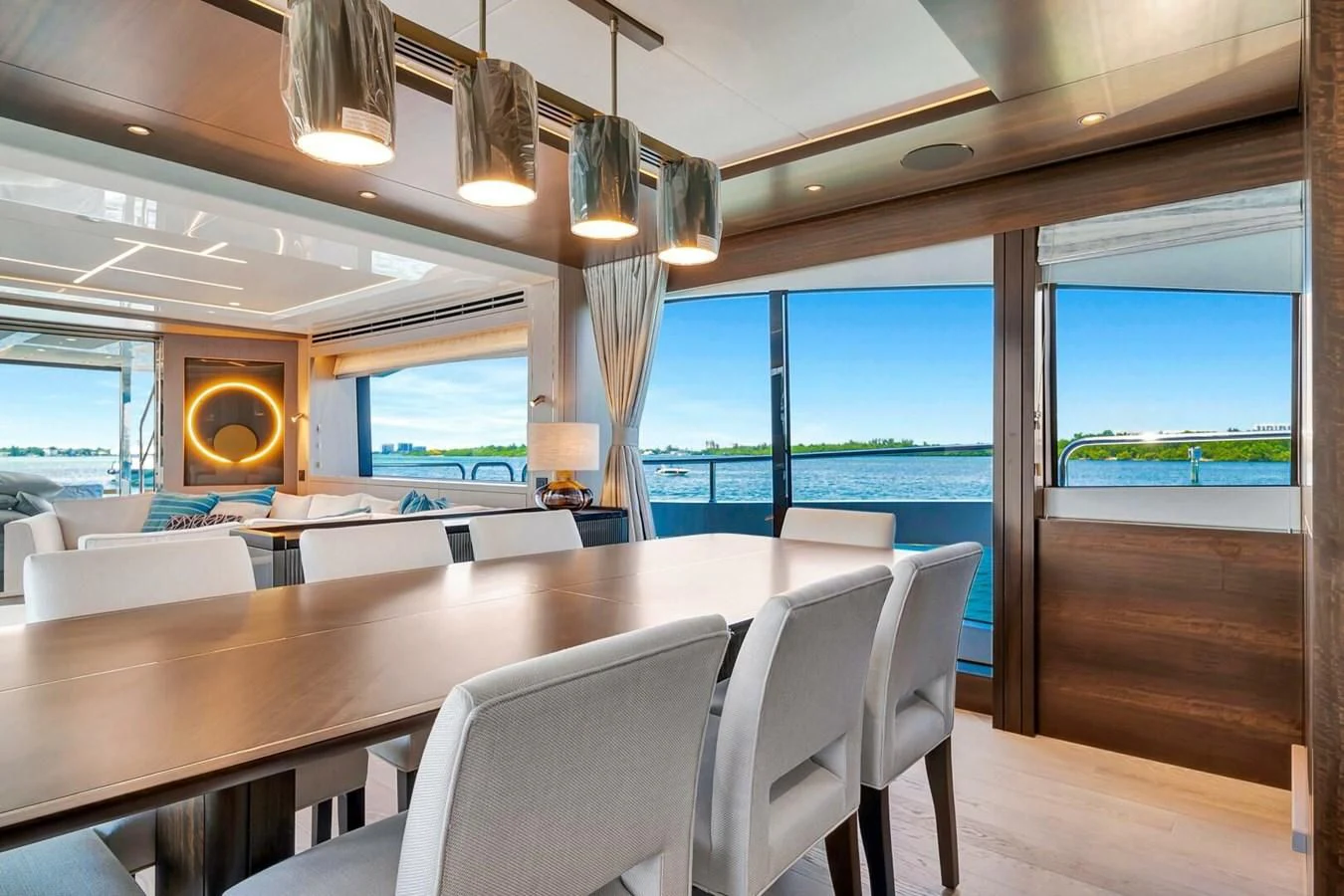 a room with a table and chairs aboard 76 YACHT Yacht for Sale