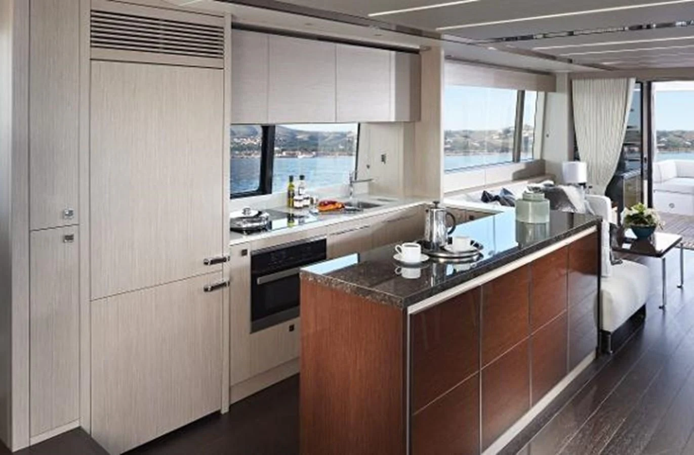 a kitchen with a large white door aboard 76 YACHT Yacht for Sale