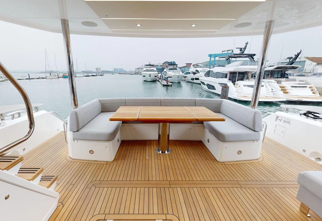 a boat dock with boats aboard 76 YACHT Yacht for Sale