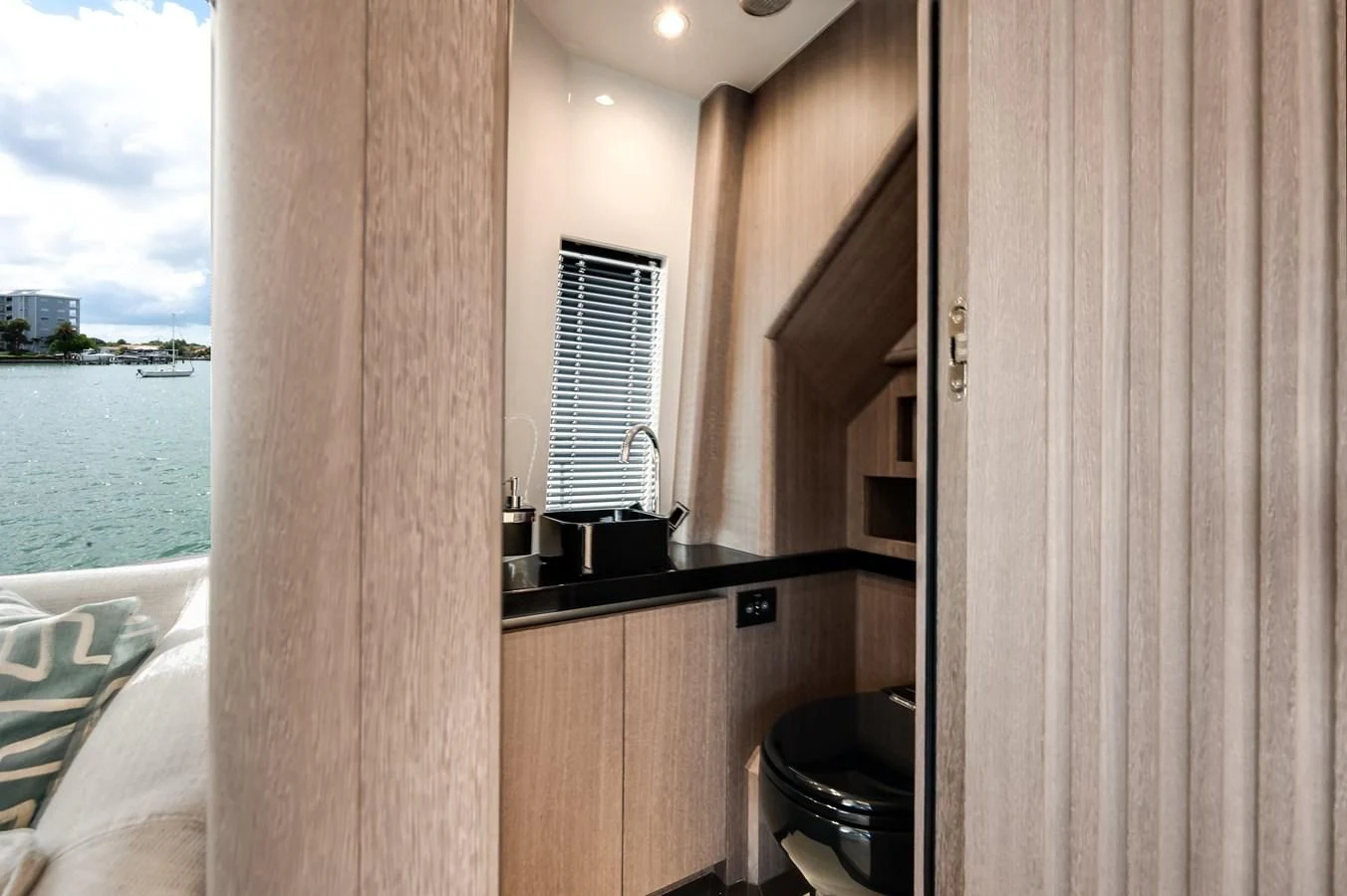 a room with a wood wall and a window aboard 76 YACHT Yacht for Sale