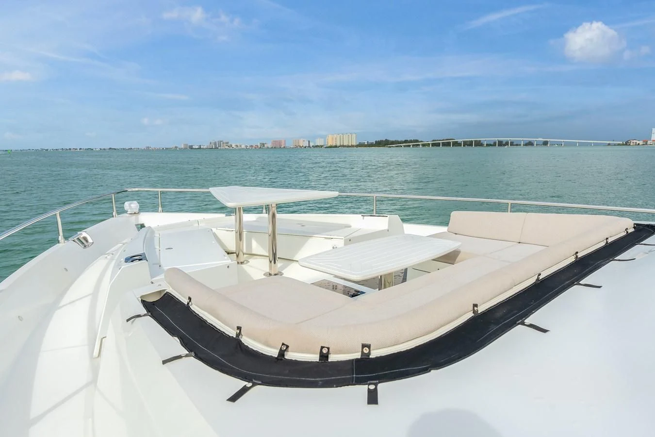 a white boat on a body of water aboard 76 YACHT Yacht for Sale