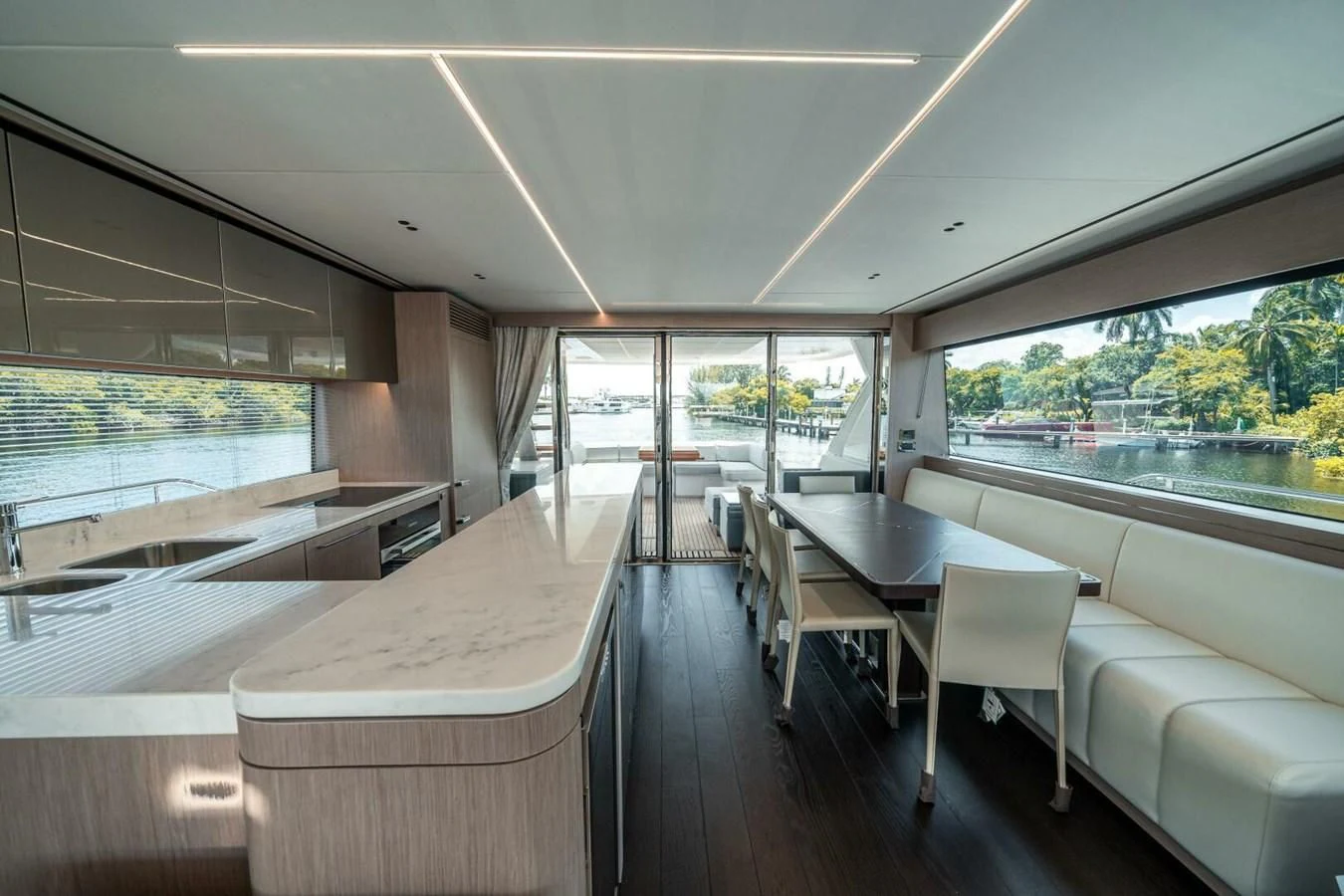 a room with a table and chairs aboard 76 YACHT Yacht for Sale