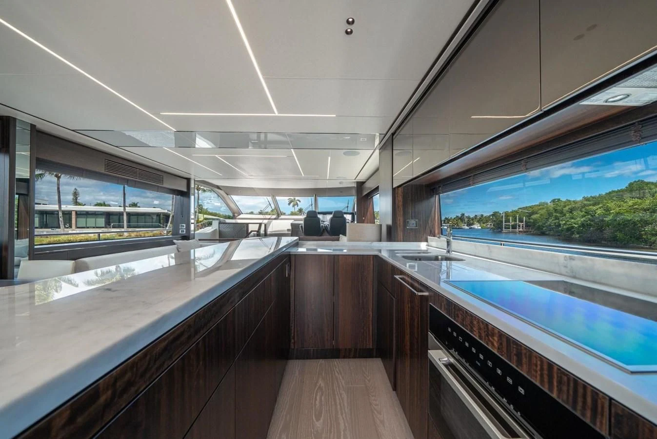a room with a large window and a wood floor with a wood floor and a large pool and aboard 76 YACHT Yacht for Sale