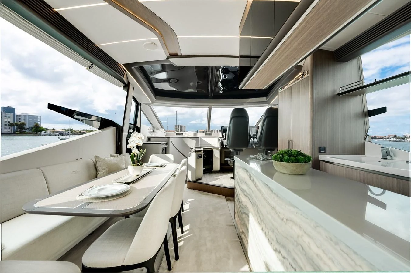 a room with a table and chairs aboard 76 YACHT Yacht for Sale