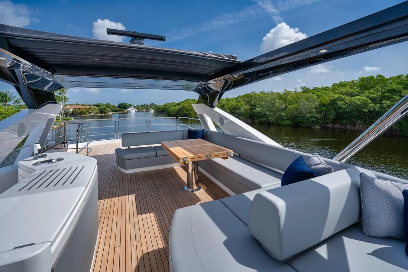 a deck with a table and chairs on it aboard 76 YACHT Yacht for Sale